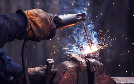 Close-up of hand doing welding works — Fabrication & Engineering in Rockhampton, QLD