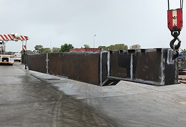 Crane Truck Lifting Metal Beams — Fabrication & Engineering in Mackay, QLD