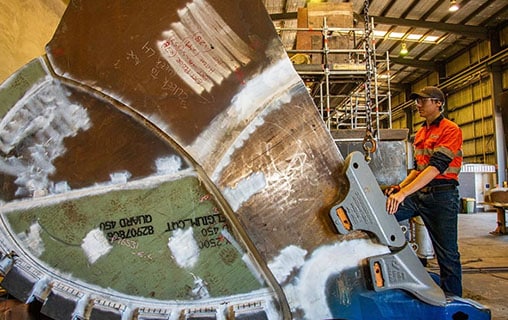 Man Working with Big Metal Machine — Fabrication & Engineering in Mackay, QLD