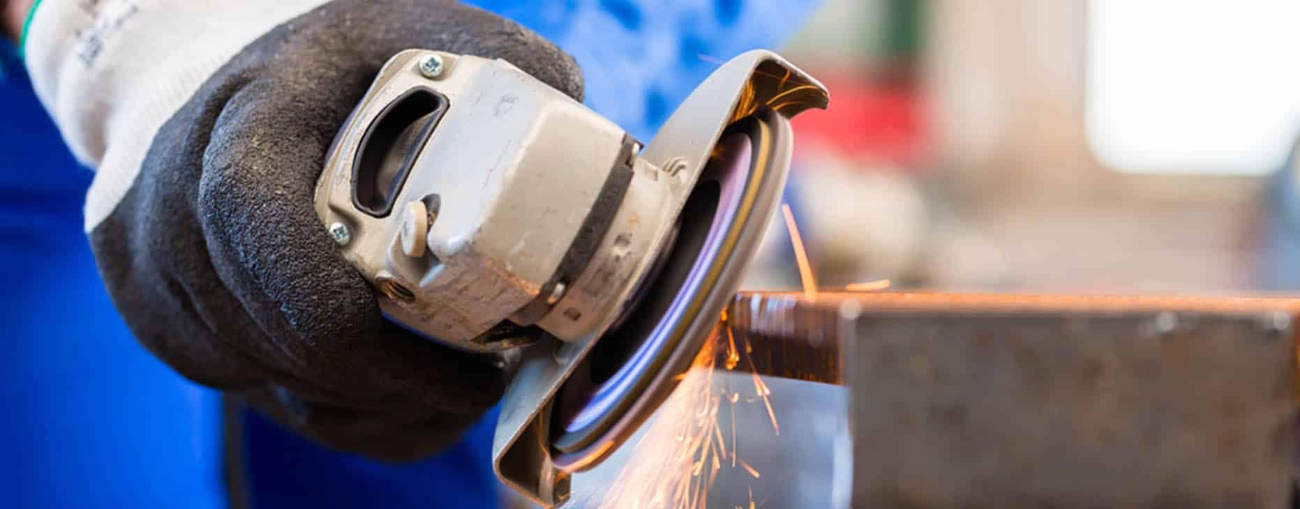 Craftsman Sawing Metal with Disk Grinder — Fabrication & Engineering in Mackay, QLD
