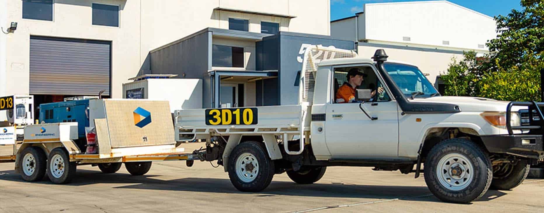 Man Driving White Pickup Truck — Fabrication & Engineering in Mackay, QLD